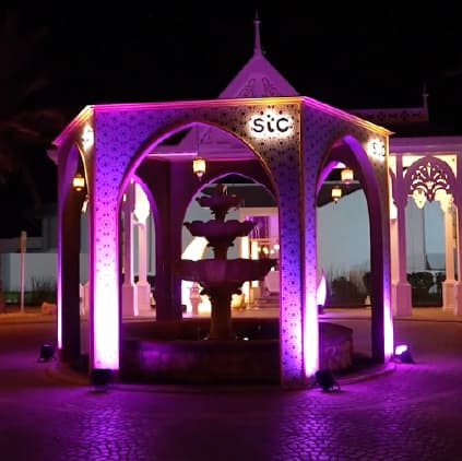 An stc gazebo lit purple at night at The Ritz-Carlton